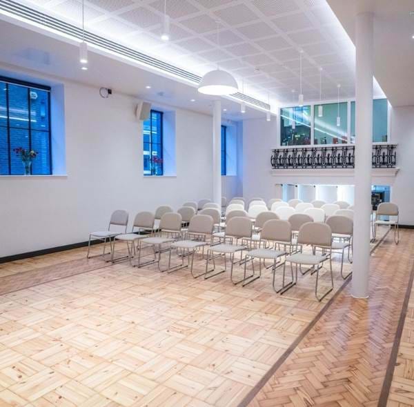 Versatile Wesleyan event space with natural light, ideal for meetings and workshops. - Banner