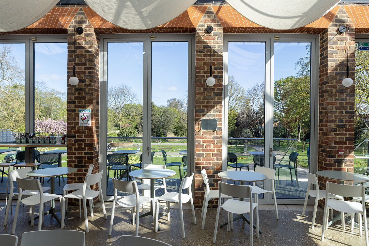 Bright event space at Glasshouse, featuring large windows for networking and meetings.
