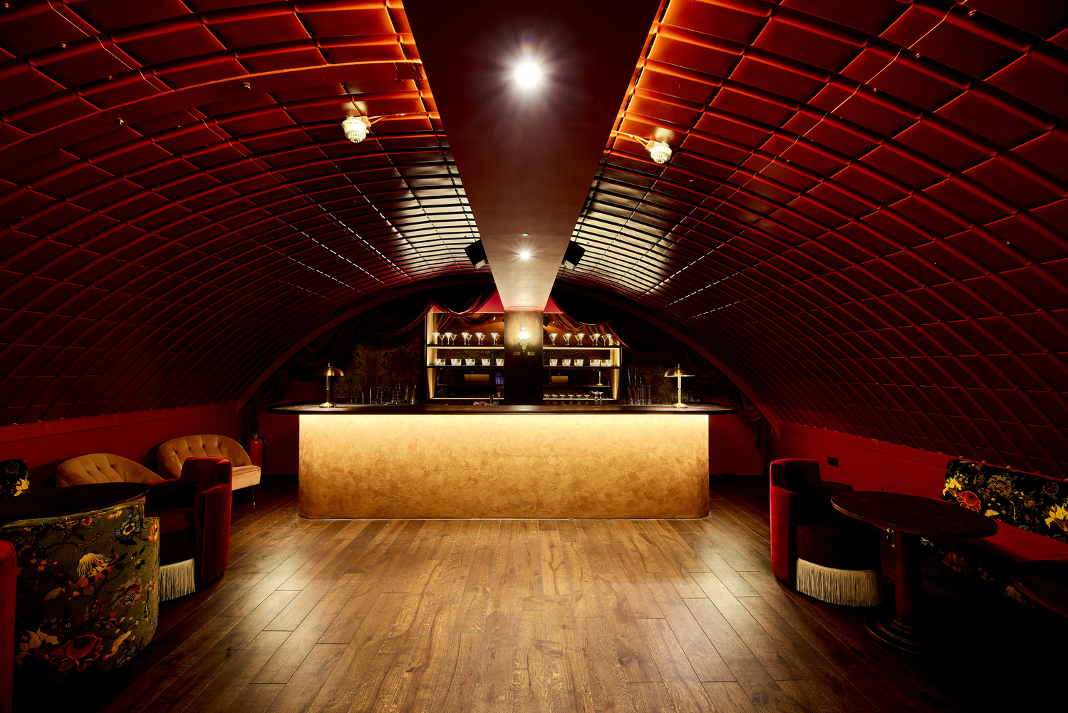 Stylish event space at Rae's in Omeara with arched ceiling, ideal for upscale gatherings.