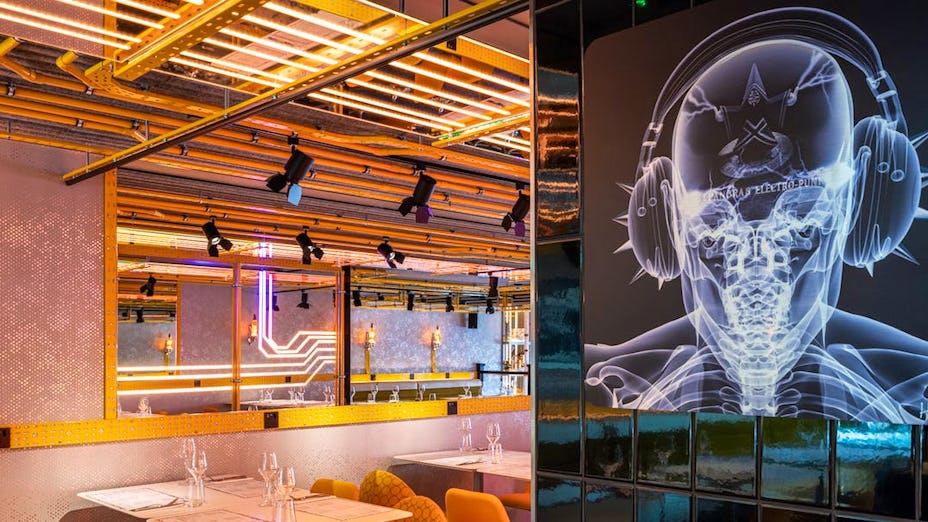 Modern restaurant venue with dynamic lighting for creative events and networking. - Banner