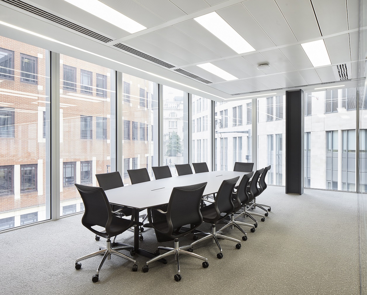 Modern conference room with large table and ergonomic chairs, ideal for meetings in London. - Banner