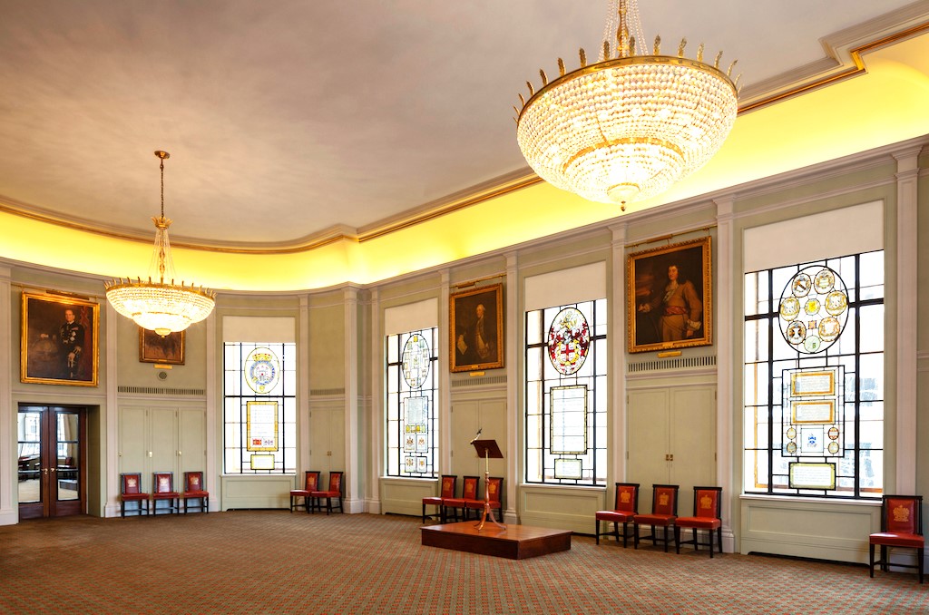 Elegant Trinity House library with stained glass, ideal for formal events and conferences. - Banner