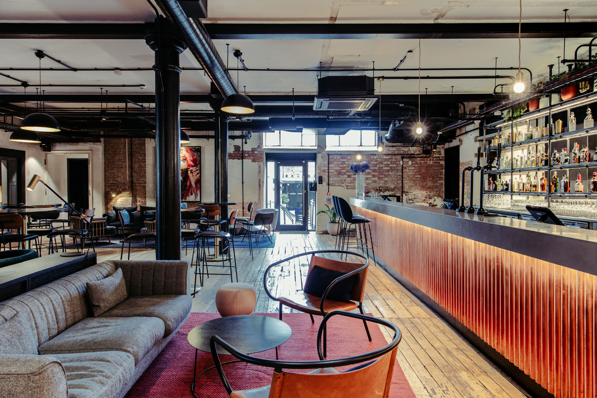 Modern Bar & Garden event venue with sleek industrial design for networking and casual gatherings.