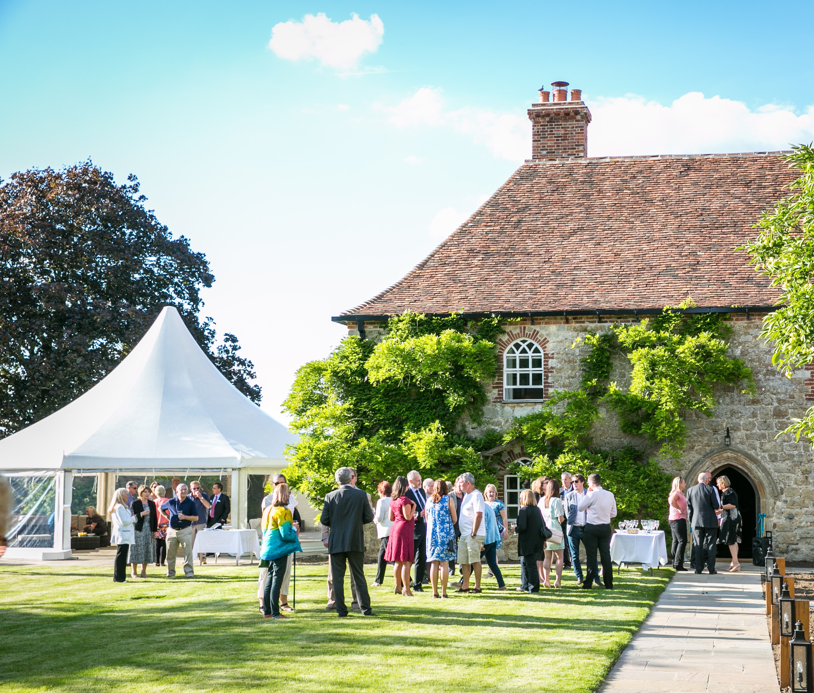 Battel Hall Leeds Castle corporate reception with marquee for high-end networking event.
