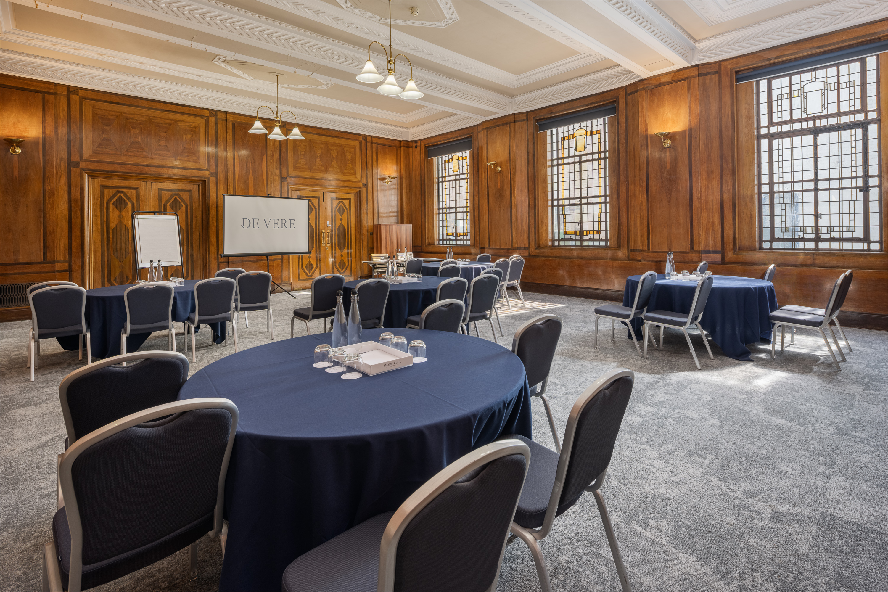 Stafford Suite in Grand Connaught Rooms set for cabaret-style corporate meeting or workshop.
