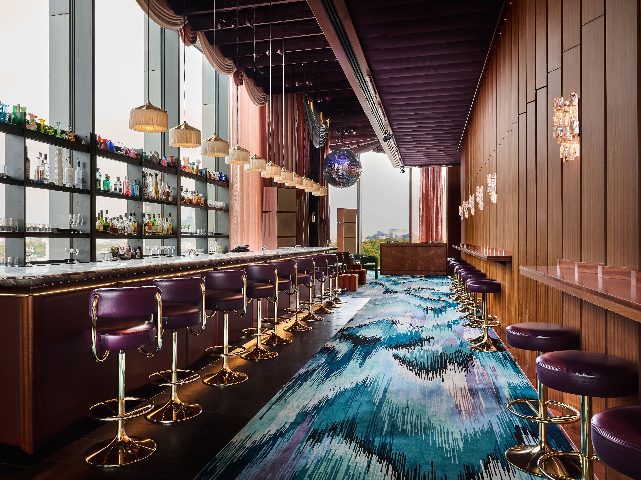 Contemporary VIP reception bar at Sweeties, London, featuring high-end decor and natural light.