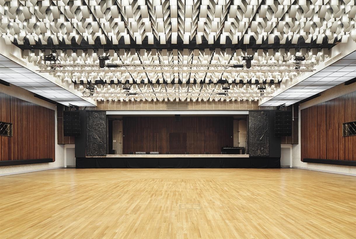 New Century Hall Manchester: spacious venue with polished wood floor for events and performances. - Banner