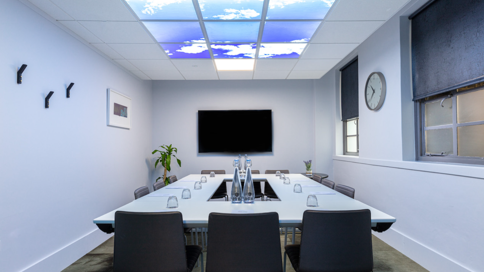 Modern meeting room at St Pancras, featuring a sky-inspired ceiling for events. - Banner