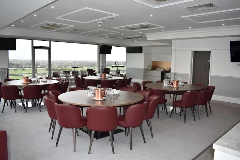 Royal Box banquet room at Sandown Park with panoramic views for corporate events and receptions.