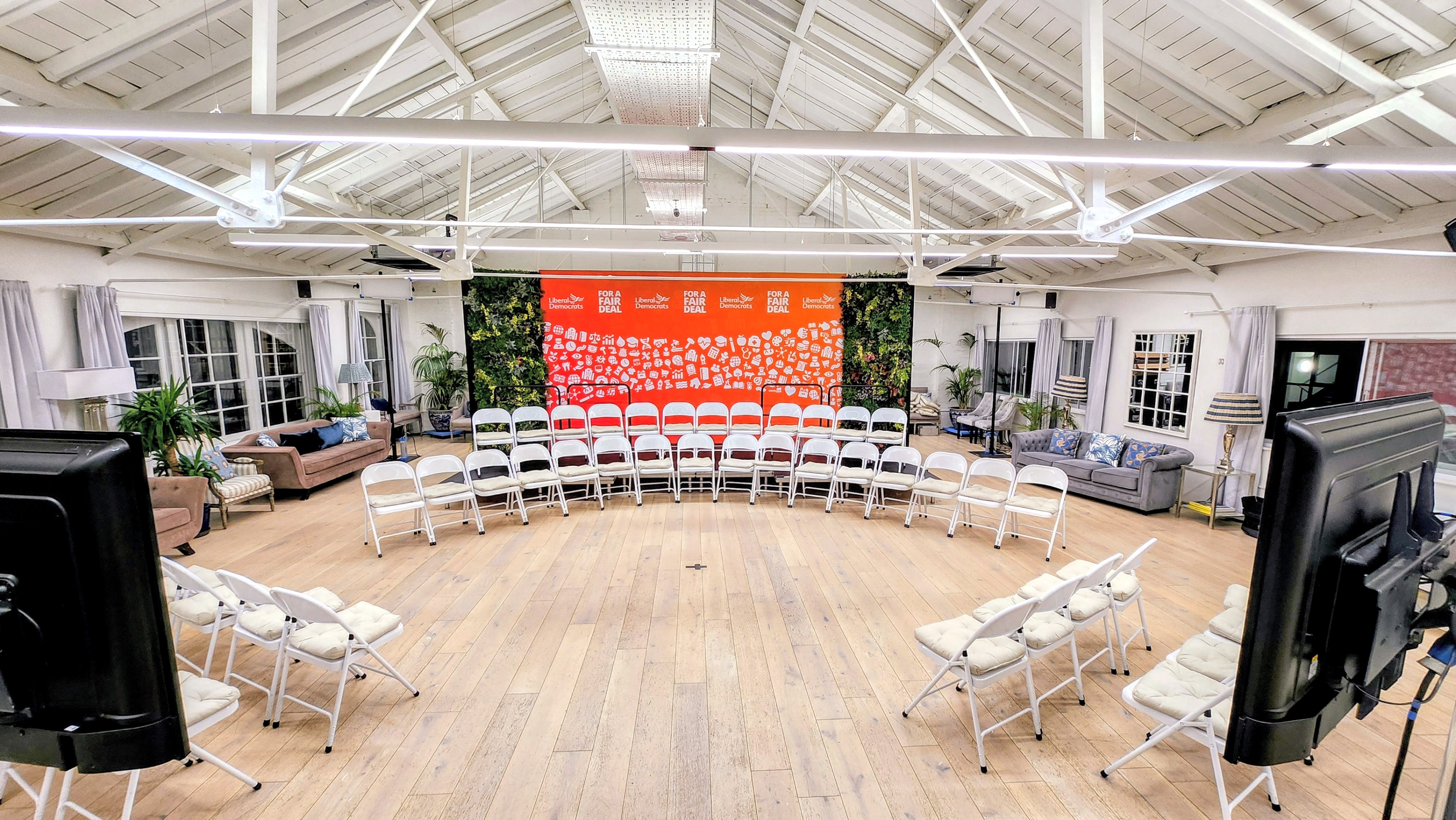 Collaborative meeting space with circular seating for workshops and brainstorming sessions.