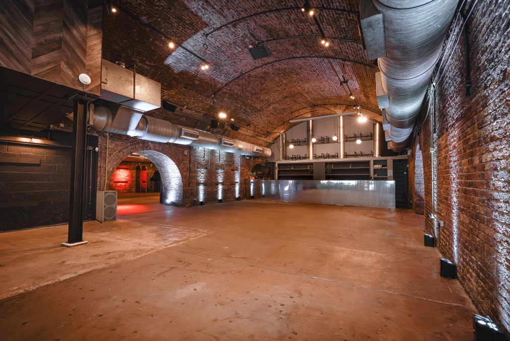 Arch 2 Rivington St: Industrial event venue, exposed brick, urban backdrop.