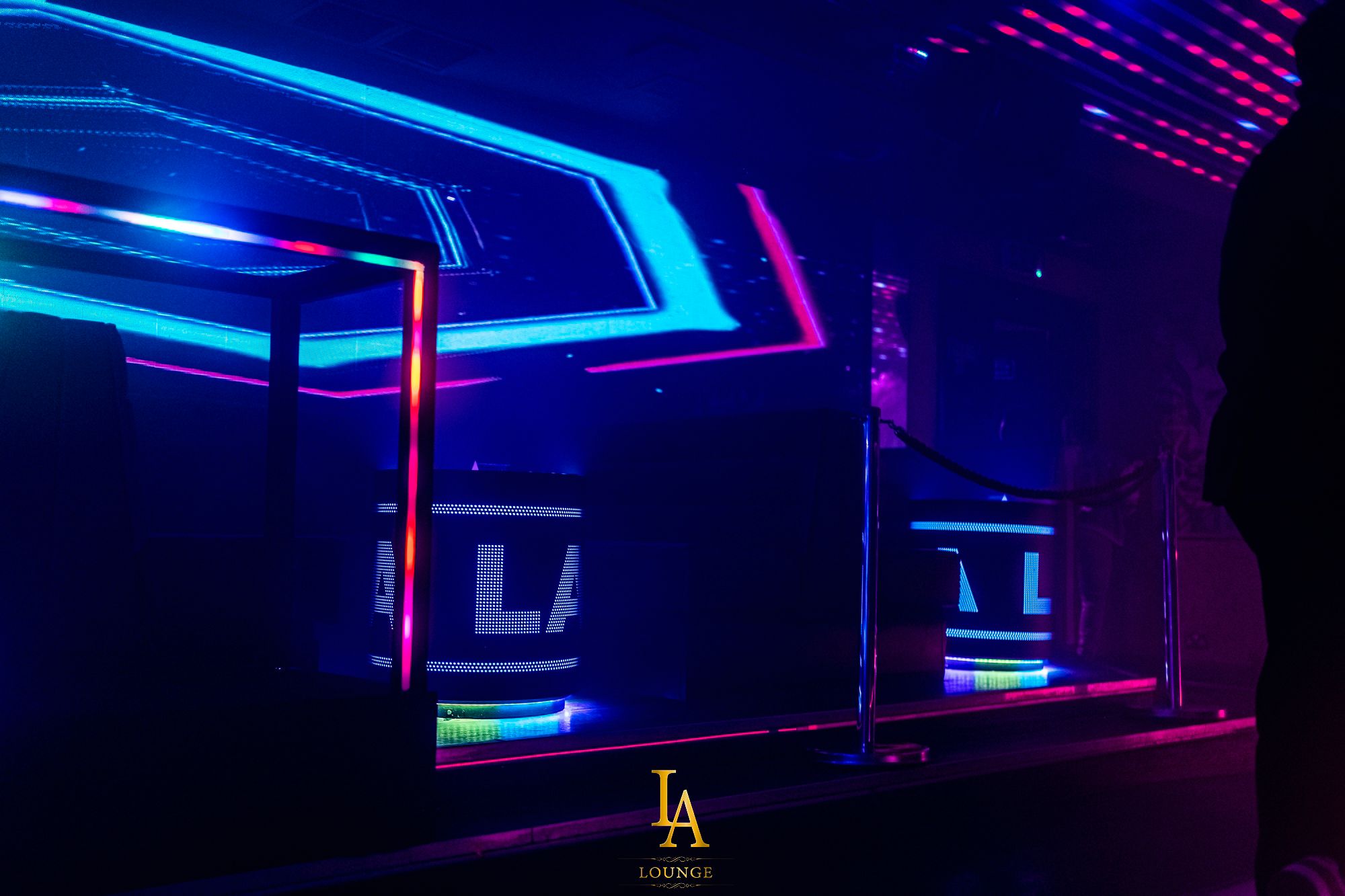 Vibrant LA Lounge event venue with colorful LED lights for nightlife and corporate parties. - Banner