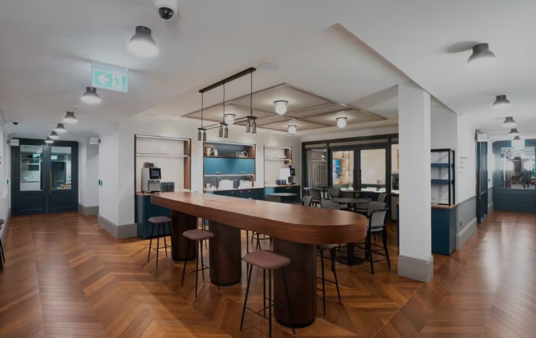 Modern common area with bar table at Salisbury House for networking events.