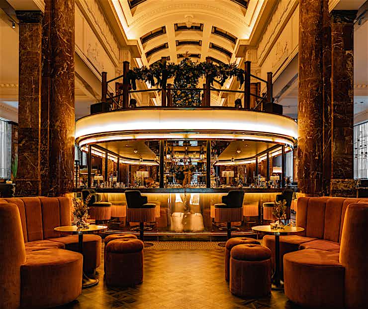 Chic bar area with plush seating, perfect for upscale networking events and celebrations.