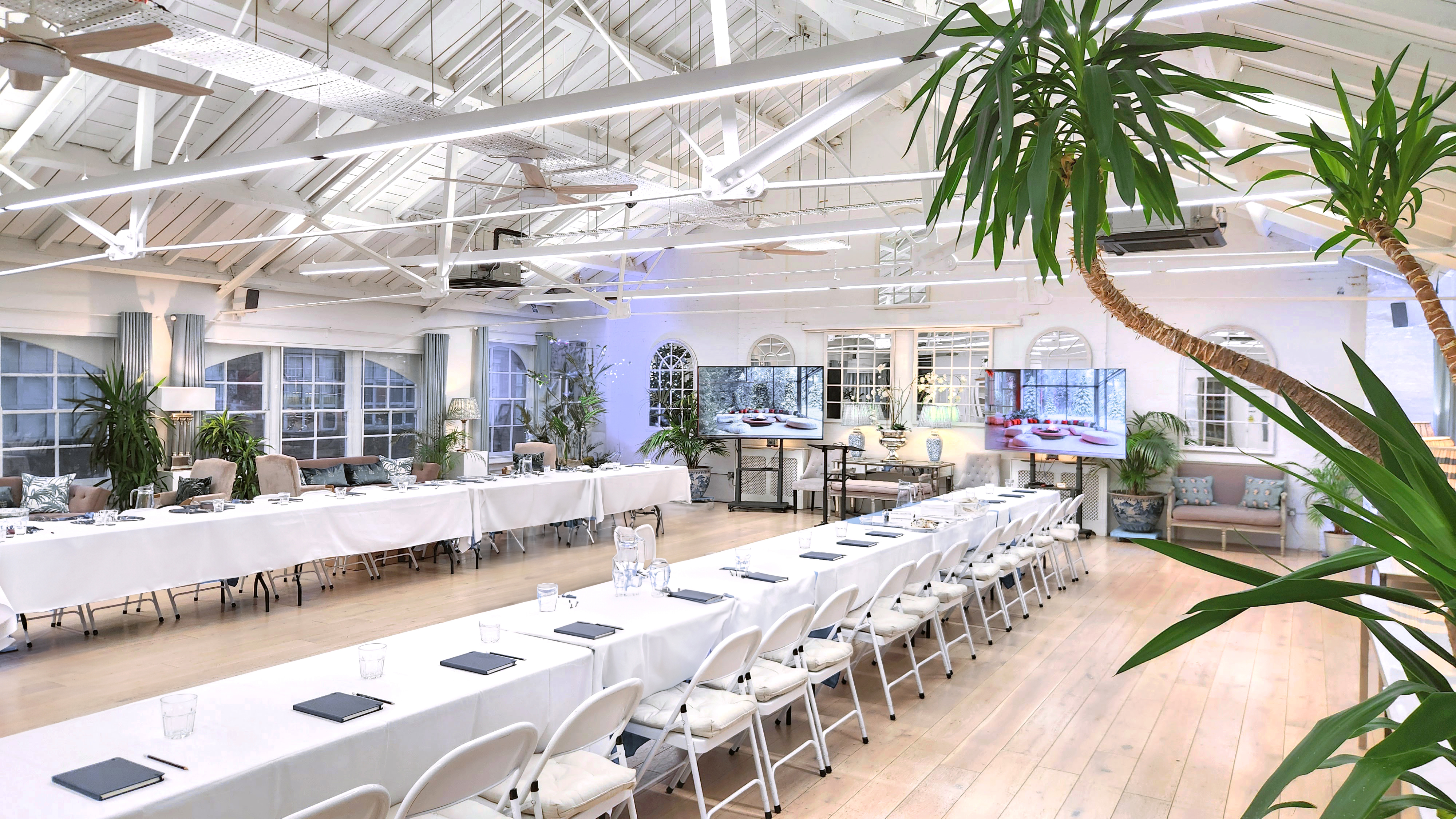 Lumiere Underwood white loft with boardroom seating for corporate workshops and business meetings.