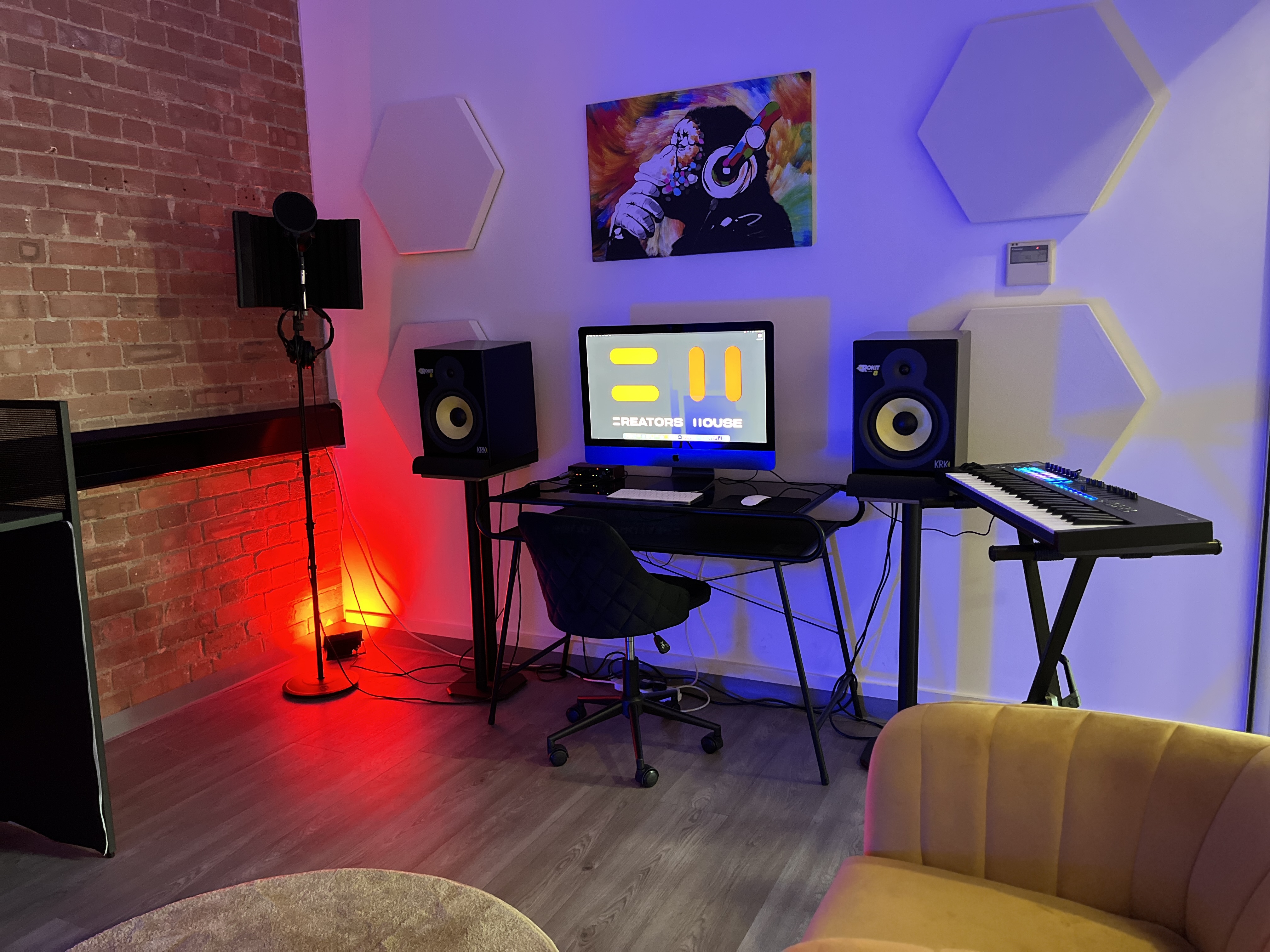 Creators House music studio with industrial brick for VIP content creation and virtual production.
