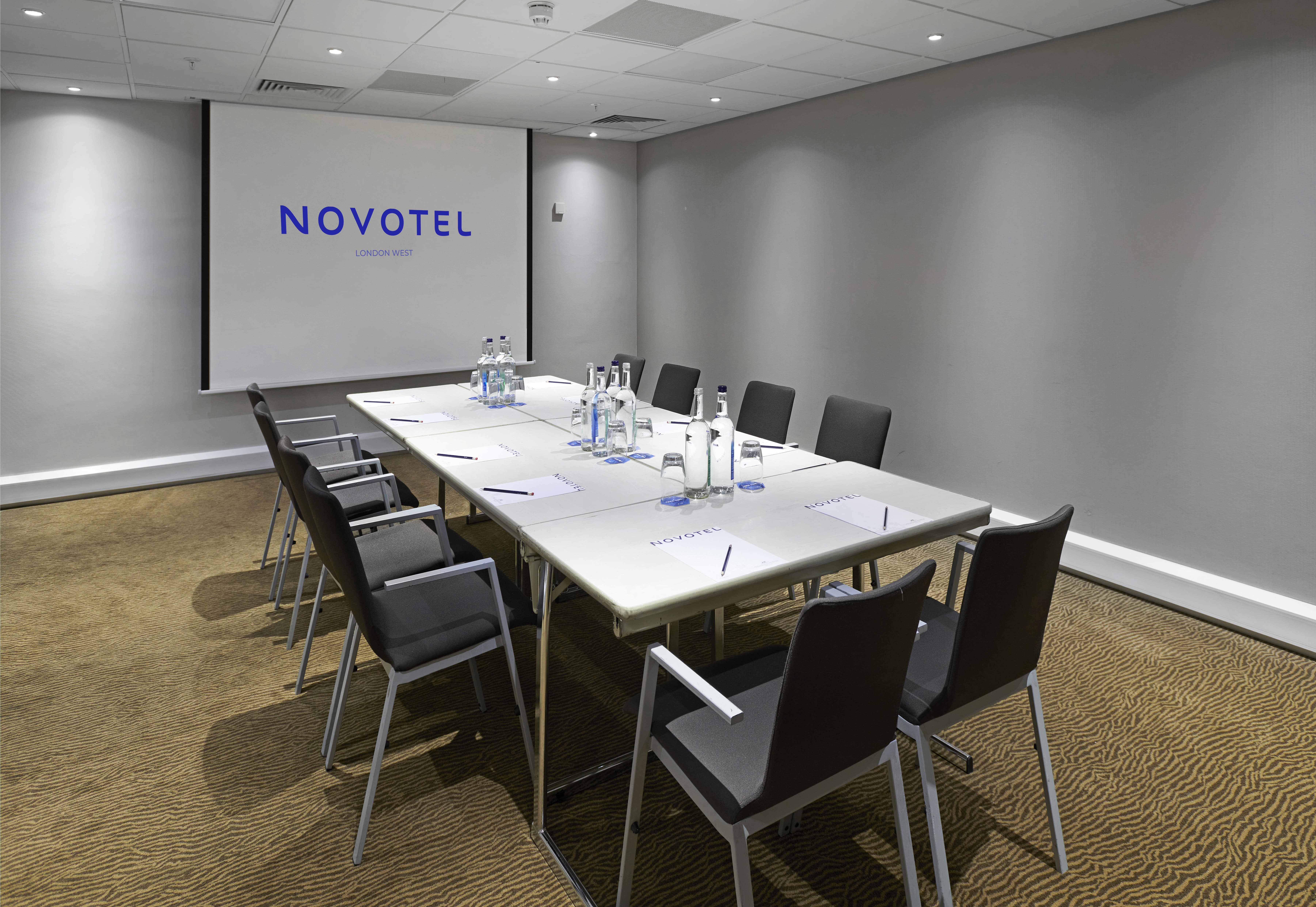 Sleek meeting room at Novotel London West, ideal for corporate events and workshops.