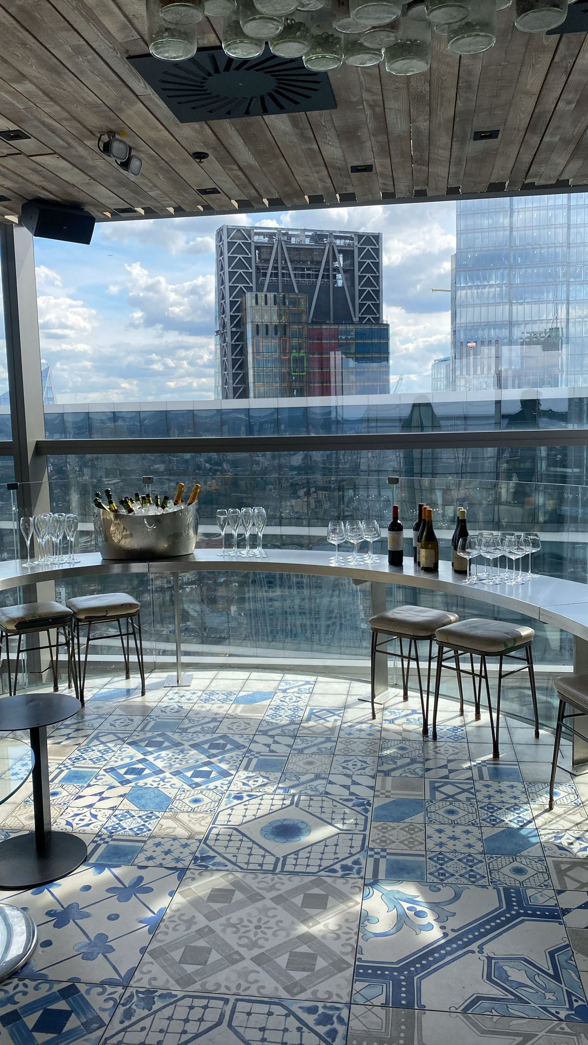 Semi-private bar event at Duck & Waffle with stylish setup and panoramic city view. - Banner