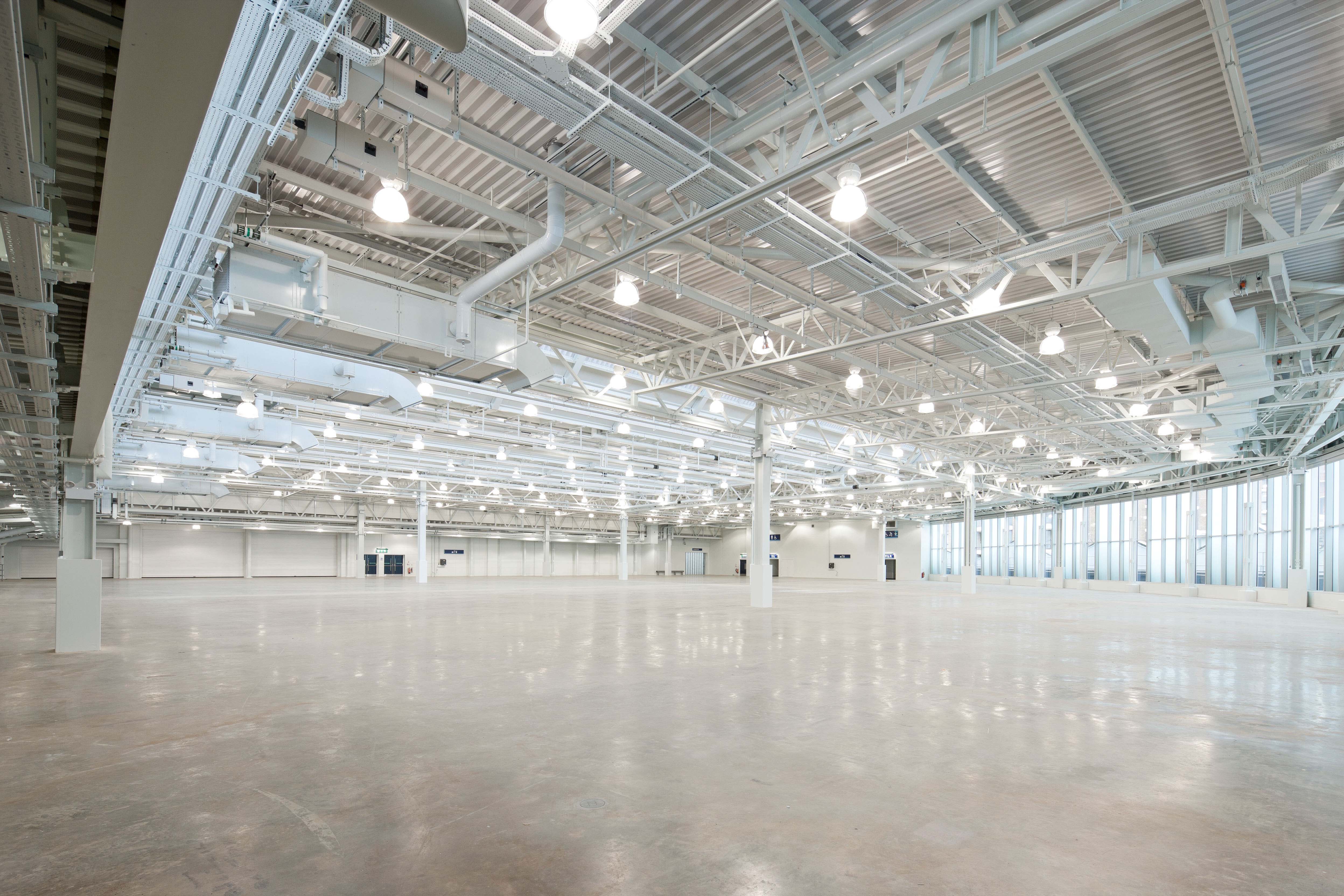 Spacious West Hall venue with high ceilings, perfect for corporate events and trade shows.
