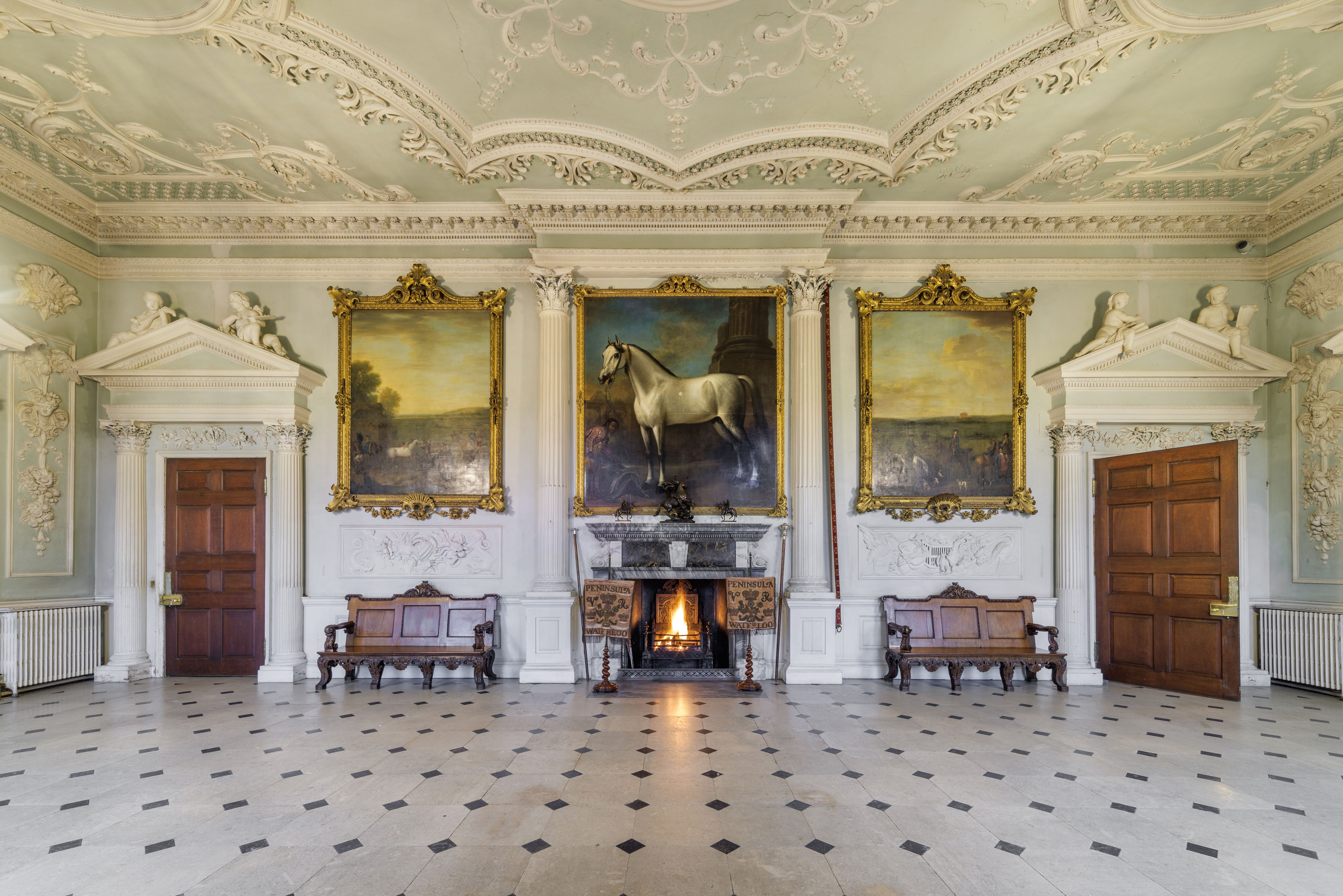 North Hall at Badminton Estate: Grand fireplace, historic reception room for corporate events.