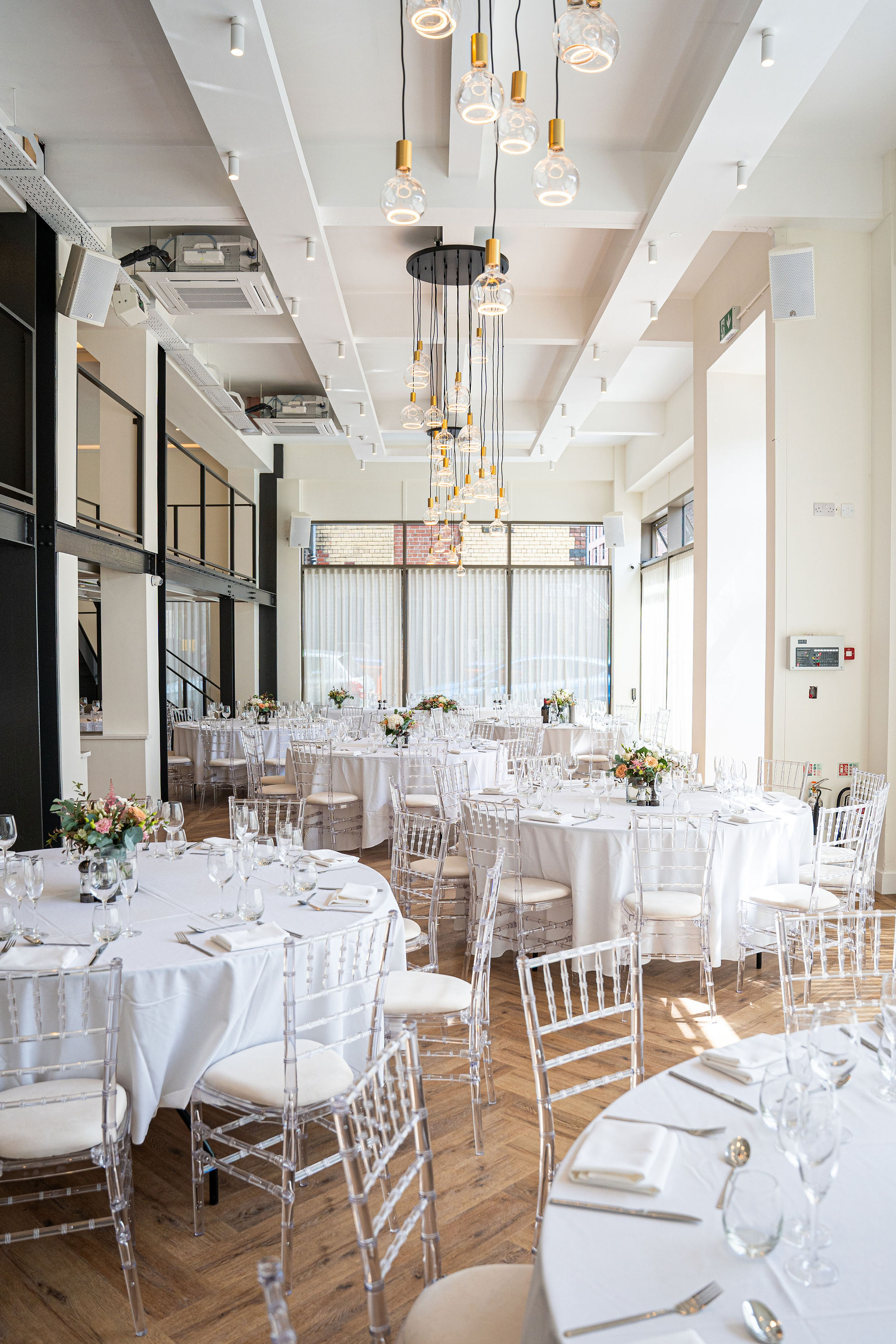 Modern industrial banquet hall at The Clubhouse, perfect for weddings and corporate events.