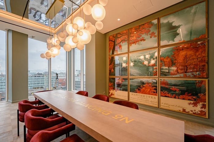 Luxury boardroom with statement chandelier for executive off-sites and VIP strategy sessions.