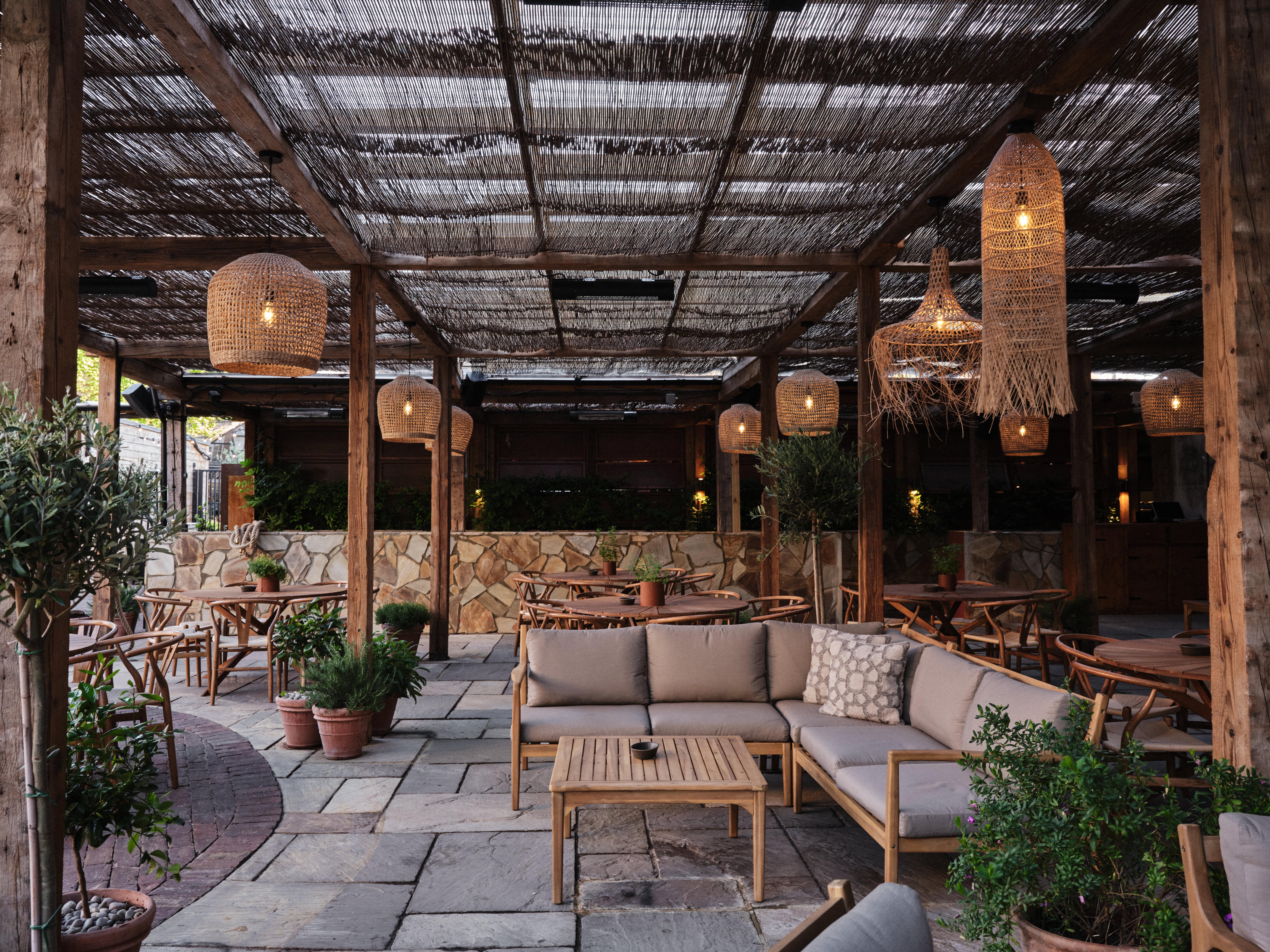 "Charming Pyro Terrace venue with warm lighting for casual meetings and events."