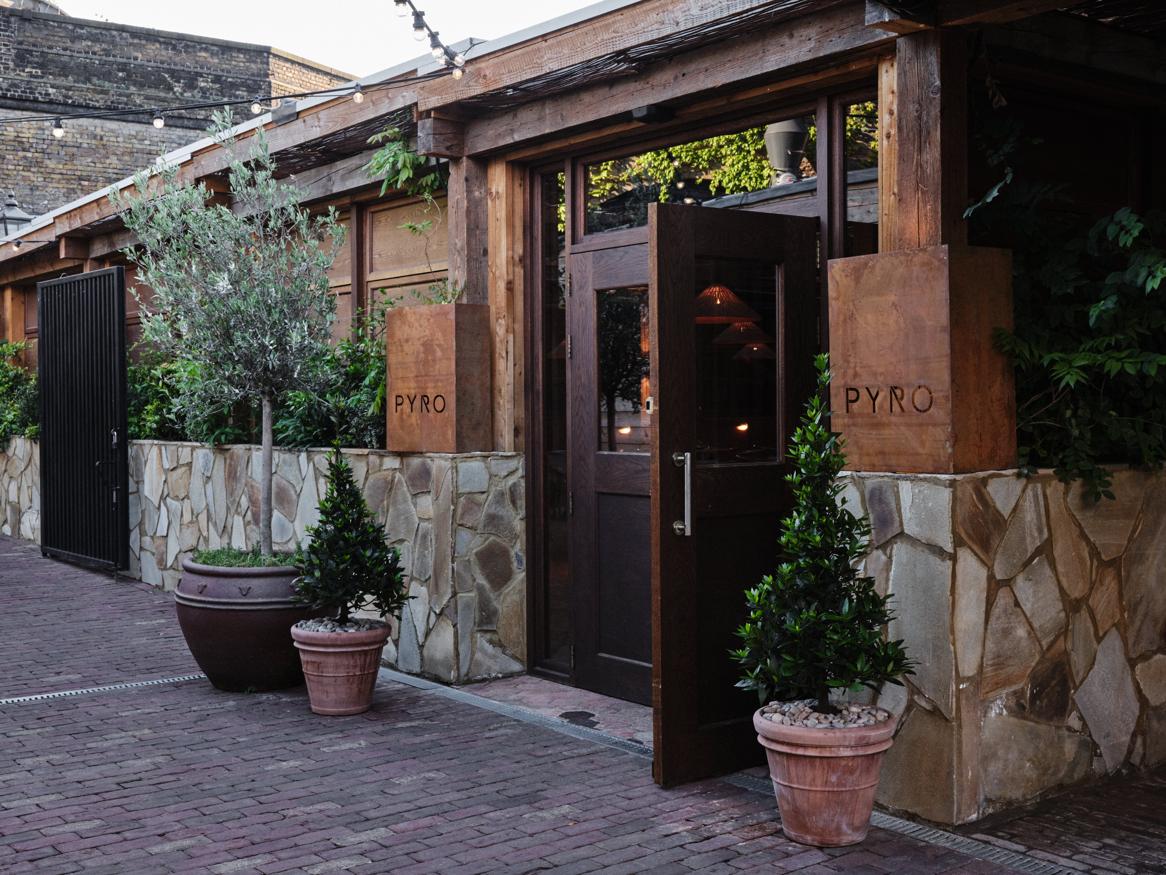 Charming entrance of Pyro Restaurant, ideal for upscale networking events and gatherings.