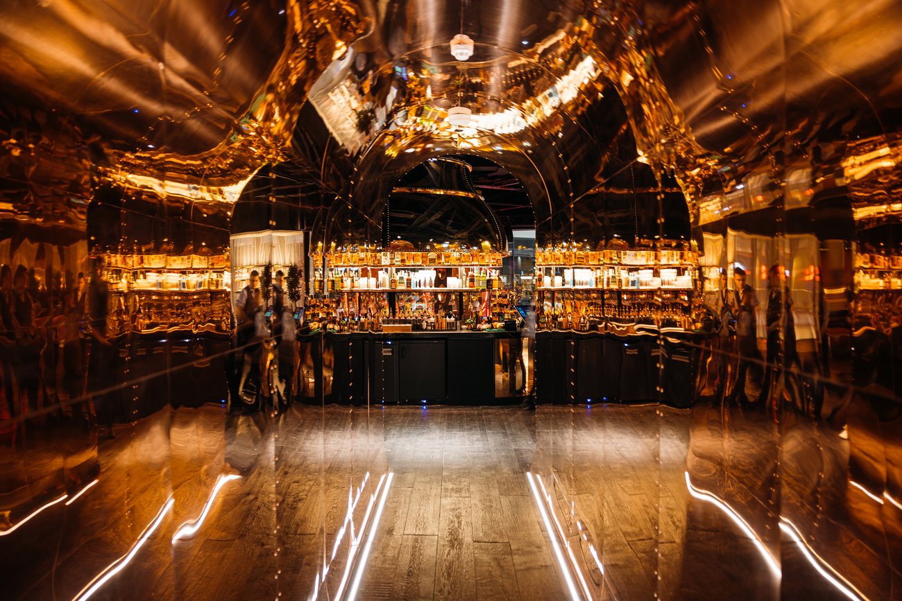 Gold-mirrored bar at Duck & Waffle Edinburgh for premium cocktail receptions and VIP after-parties.