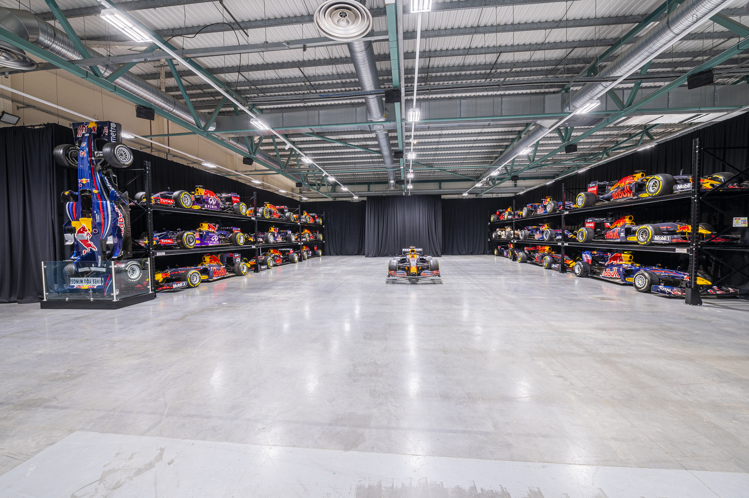 MK-7 Warehouse event space with race cars, ideal for corporate gatherings and brand activations