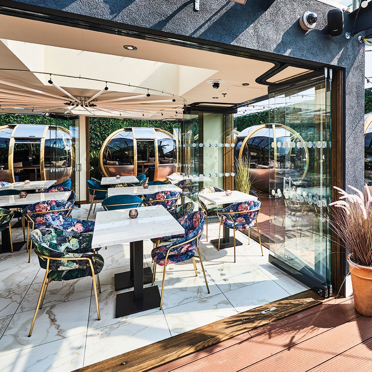 Luxury sky bar with modular dining pods for exclusive VIP events and corporate functions.