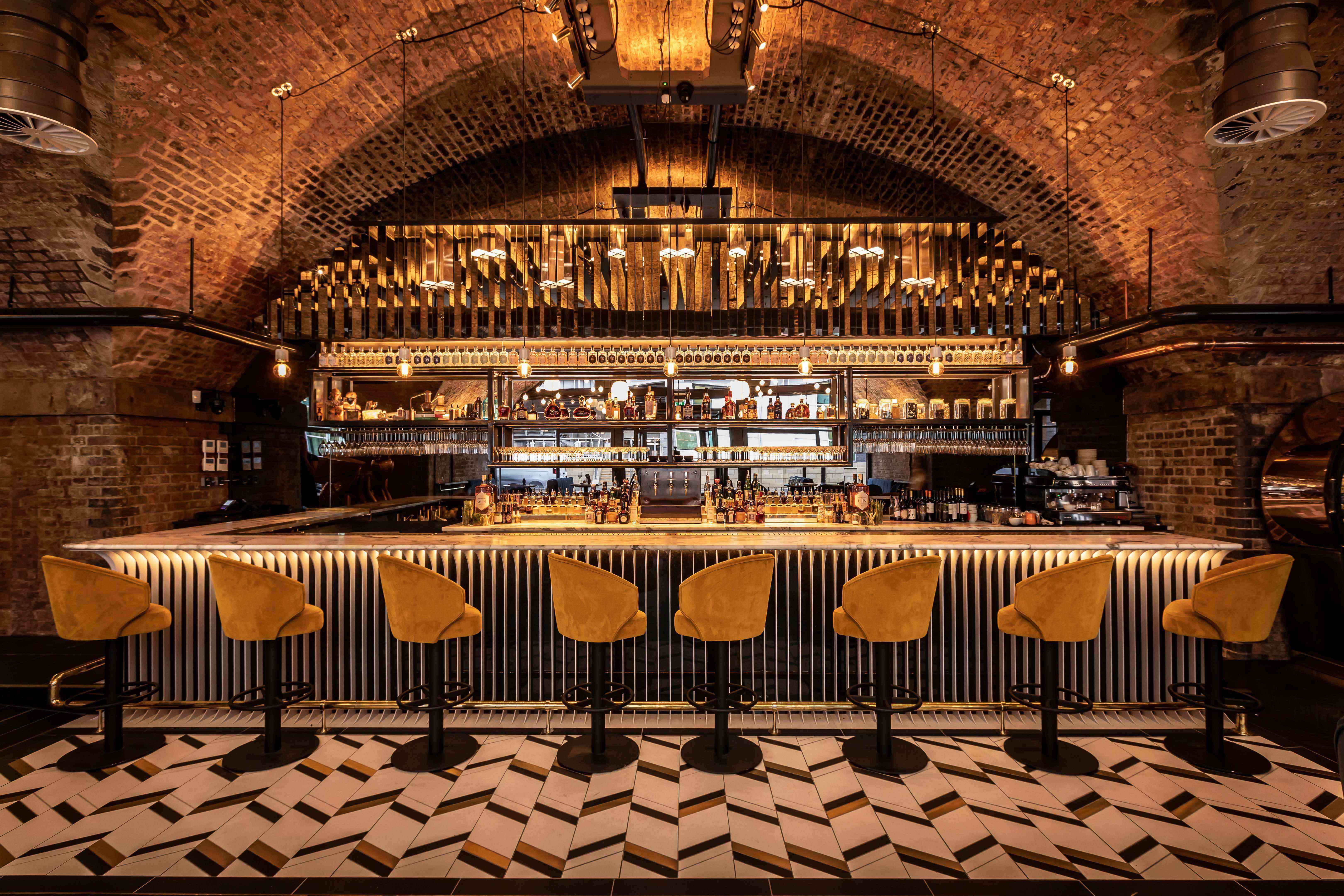 Vaulted bar event space at Spirit of Manchester Distillery for cocktail receptions and product launches.