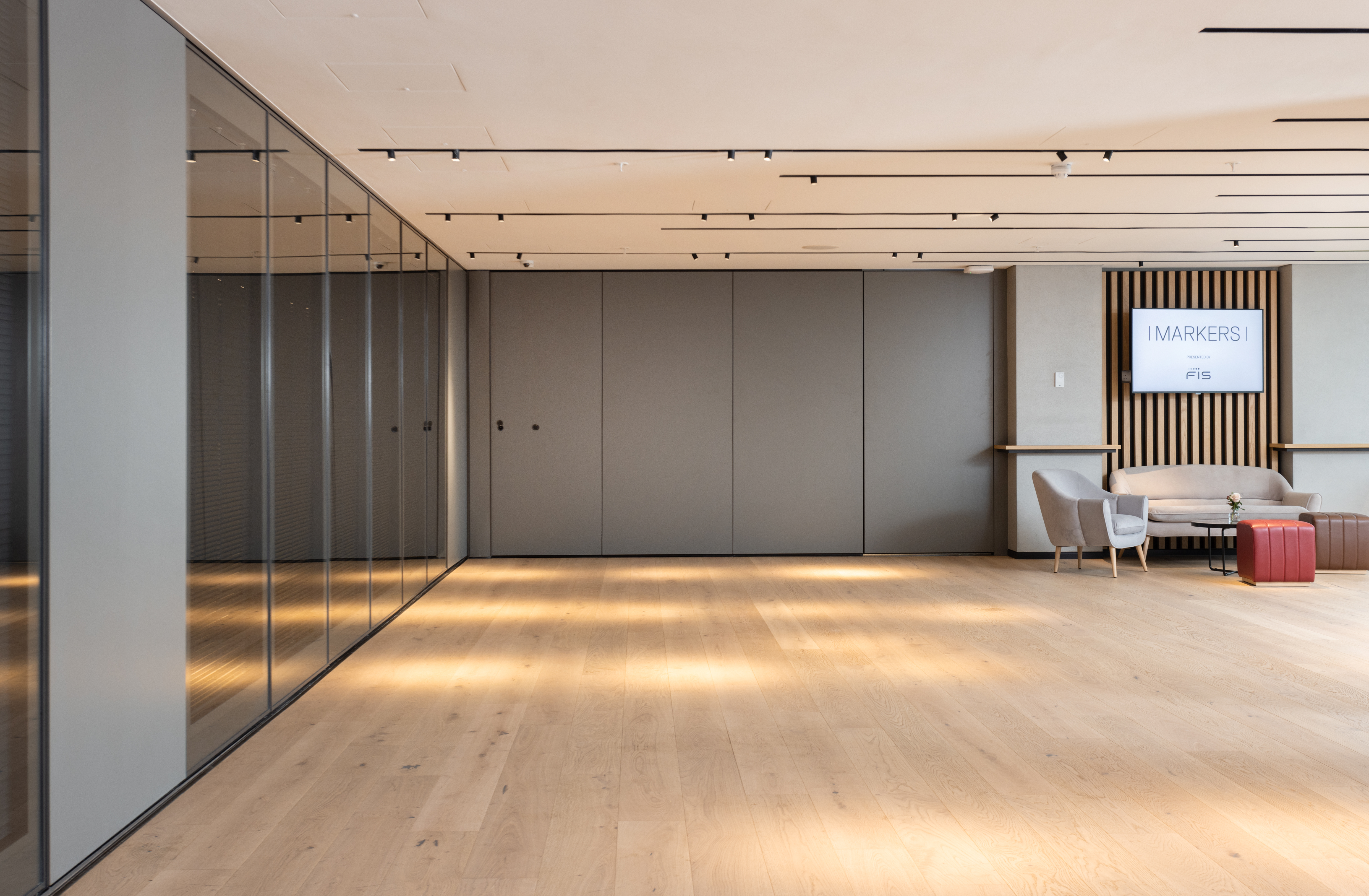 Modern event space at Fulham Pier, featuring glass walls for networking and collaboration.