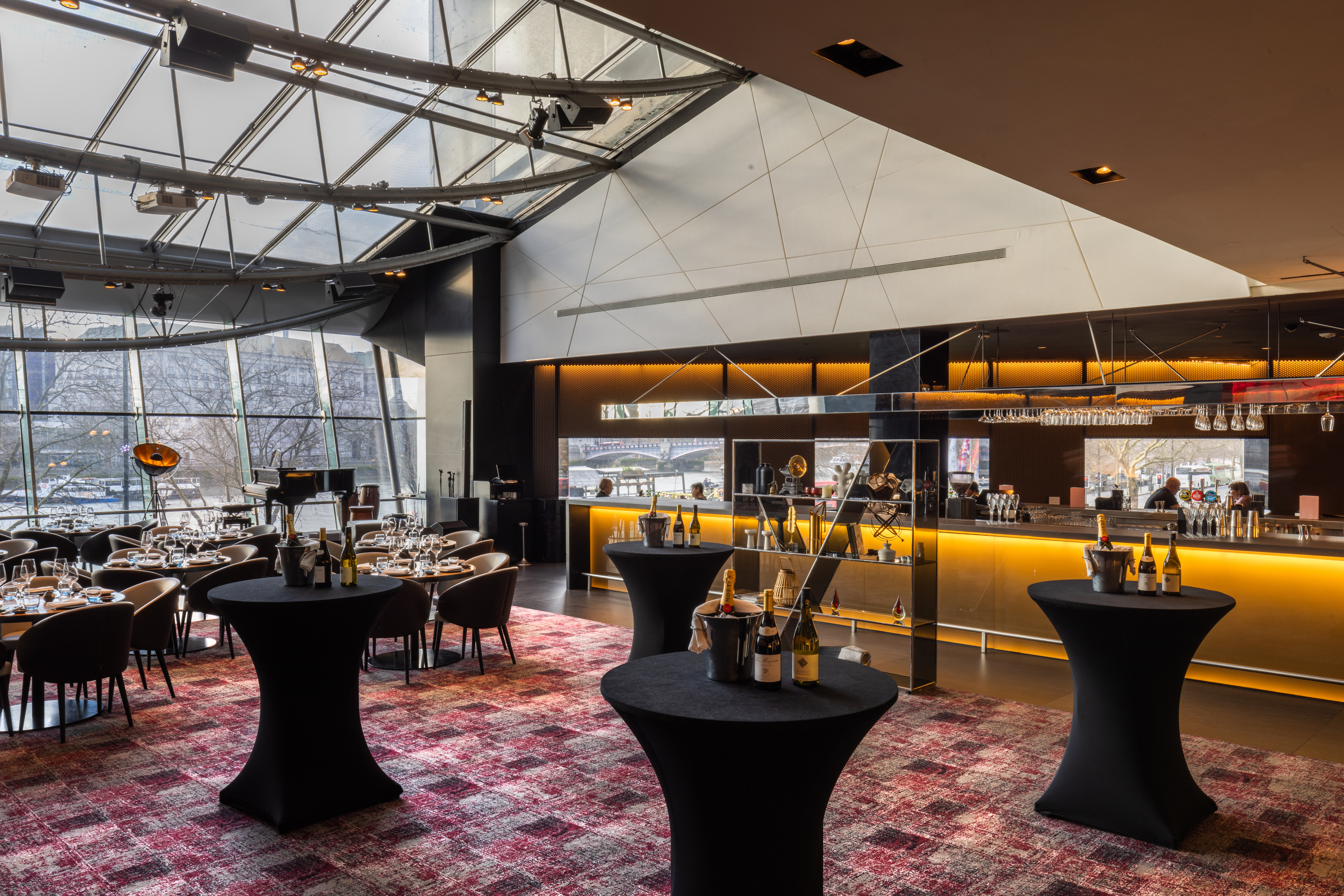 "Chino Latino event space with cocktail tables, ideal for corporate gatherings and parties." - Banner