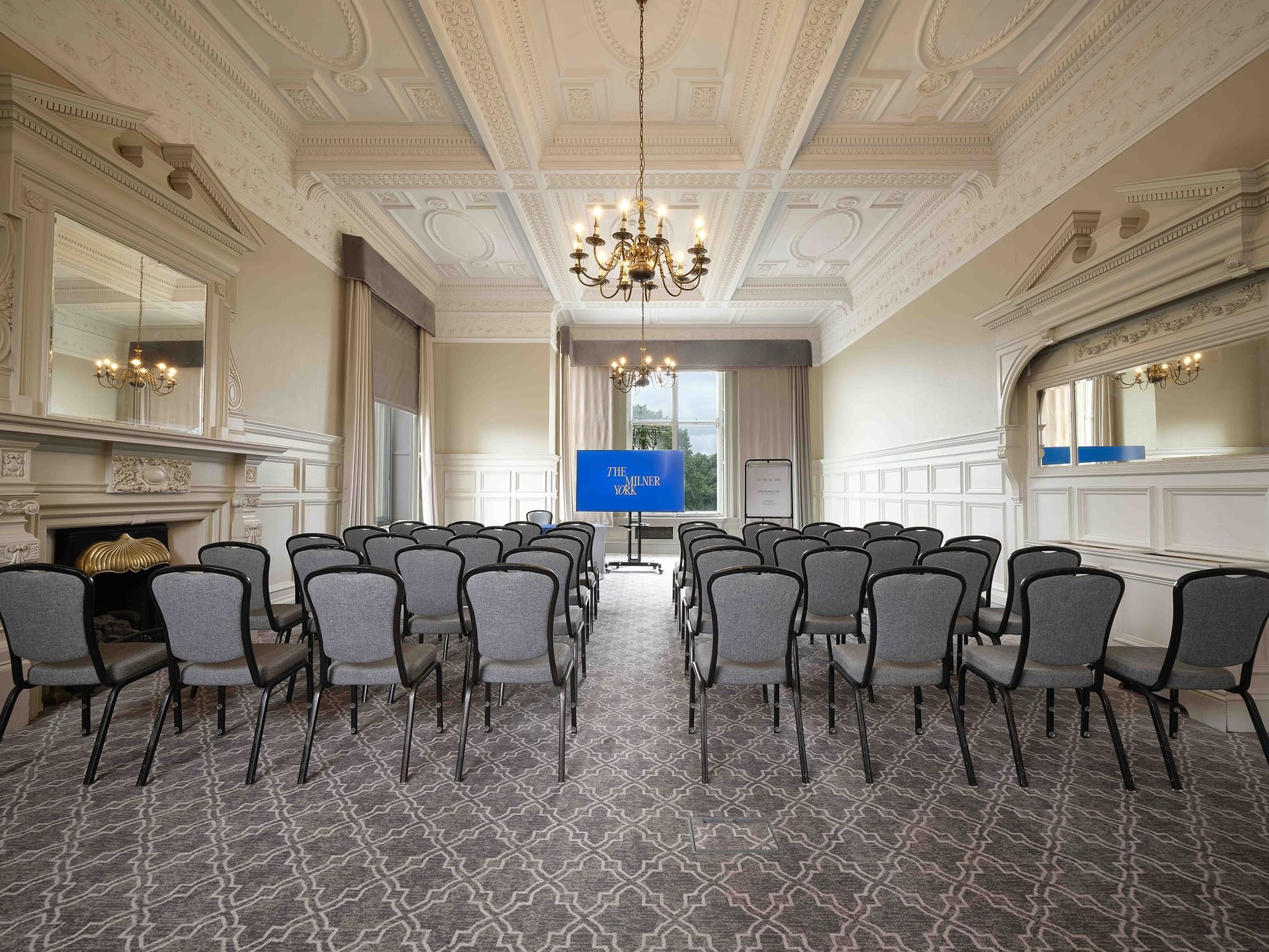 Elegant meeting room at The Milner York with theater seating for corporate events.