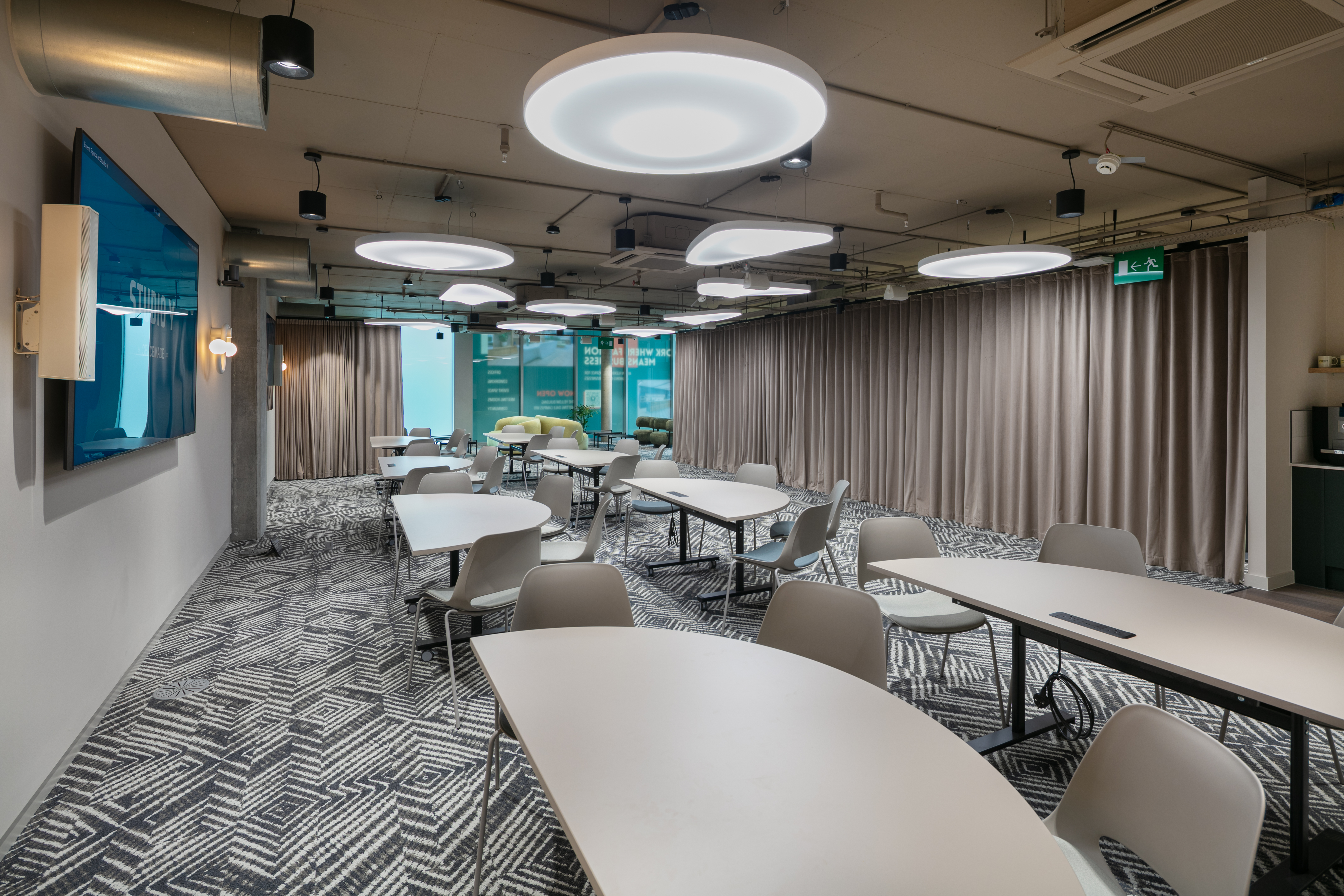 Modern meeting space at The Atrium with cabaret seating for workshops and collaborative sessions.