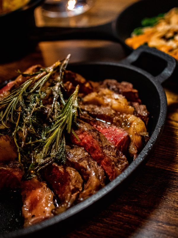 Cast-iron presentation at Carne Hove restaurant for rustic-chic catering and upscale dinner events.