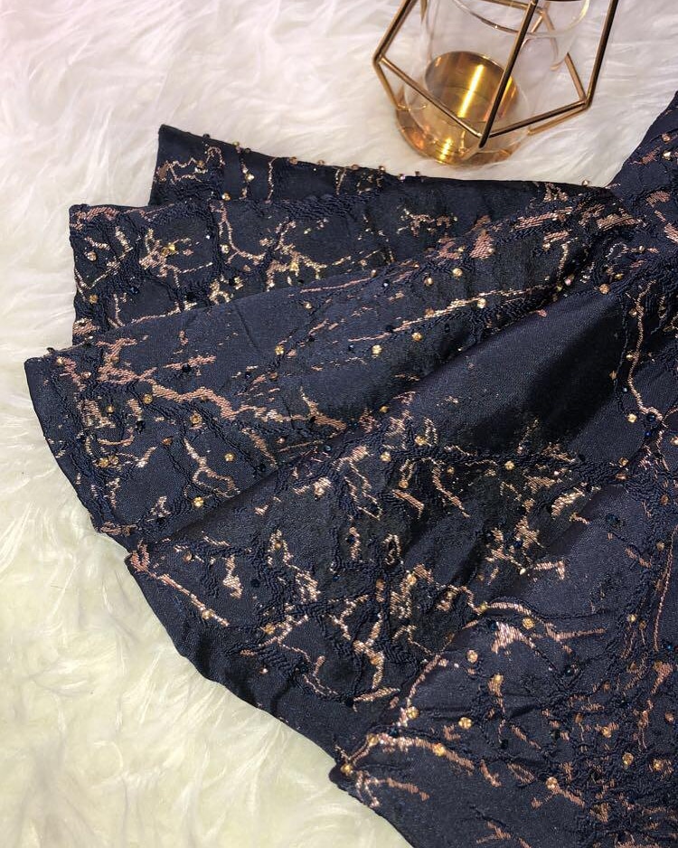Luxurious fabric with intricate designs for upscale events and fashion decor.