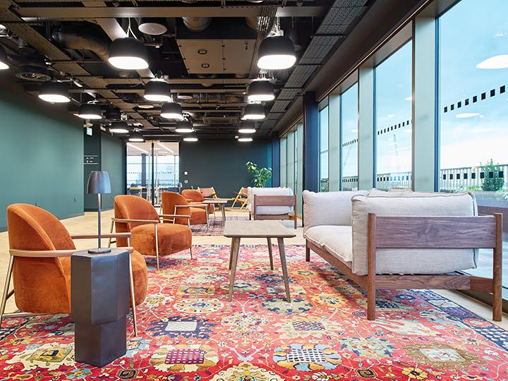 Modern meeting room with lounge seating for networking and creative corporate brainstorming.