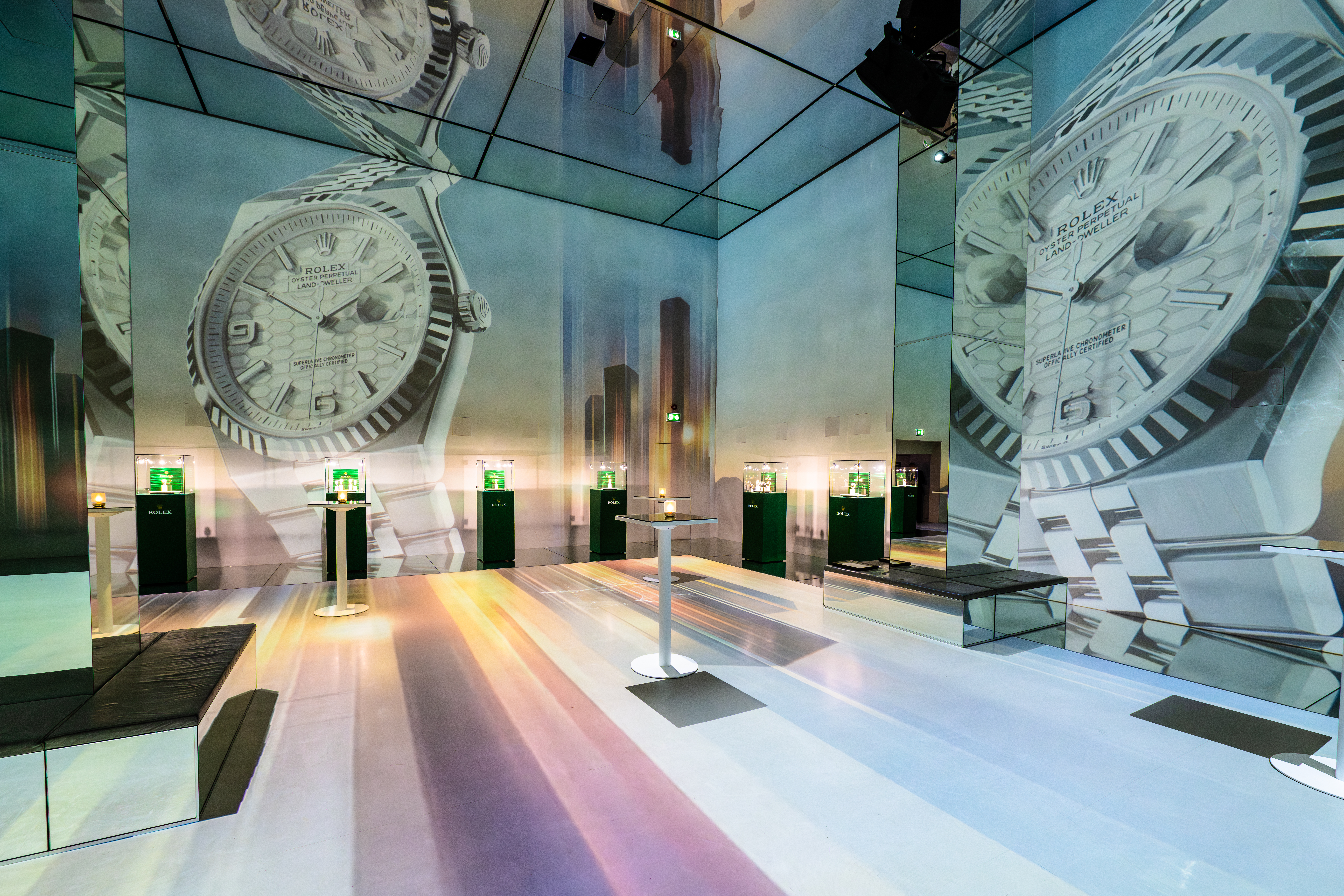Sleek event space with mirrored walls, ideal for luxury brand activations and launches. - Banner