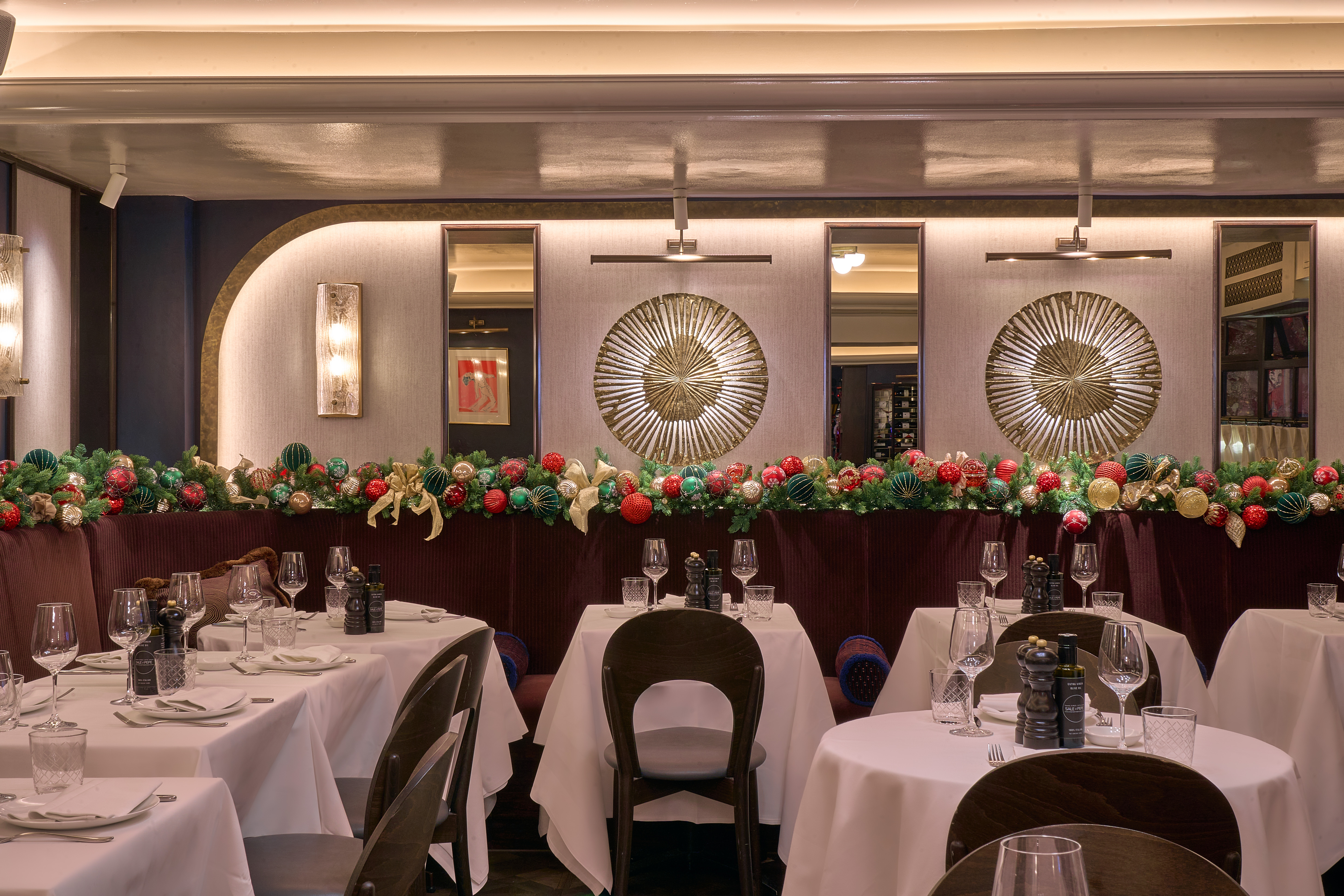 Private dining room at Sale e Pepe Knightsbridge with festive floral decor for holiday events.