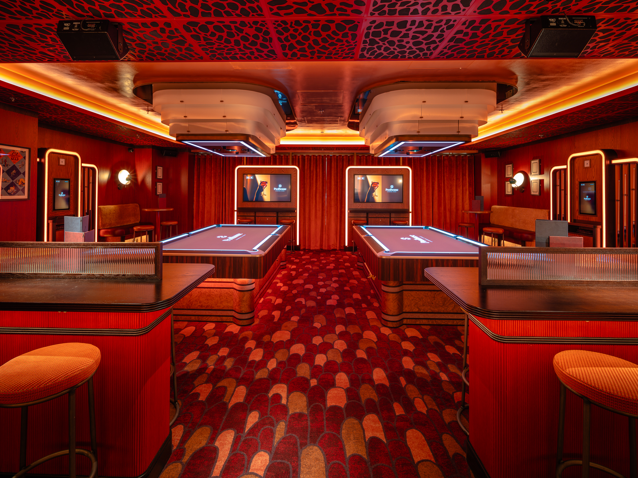 Queen Vera Suite: Immersive red breakout space for corporate events and VIP hospitality.