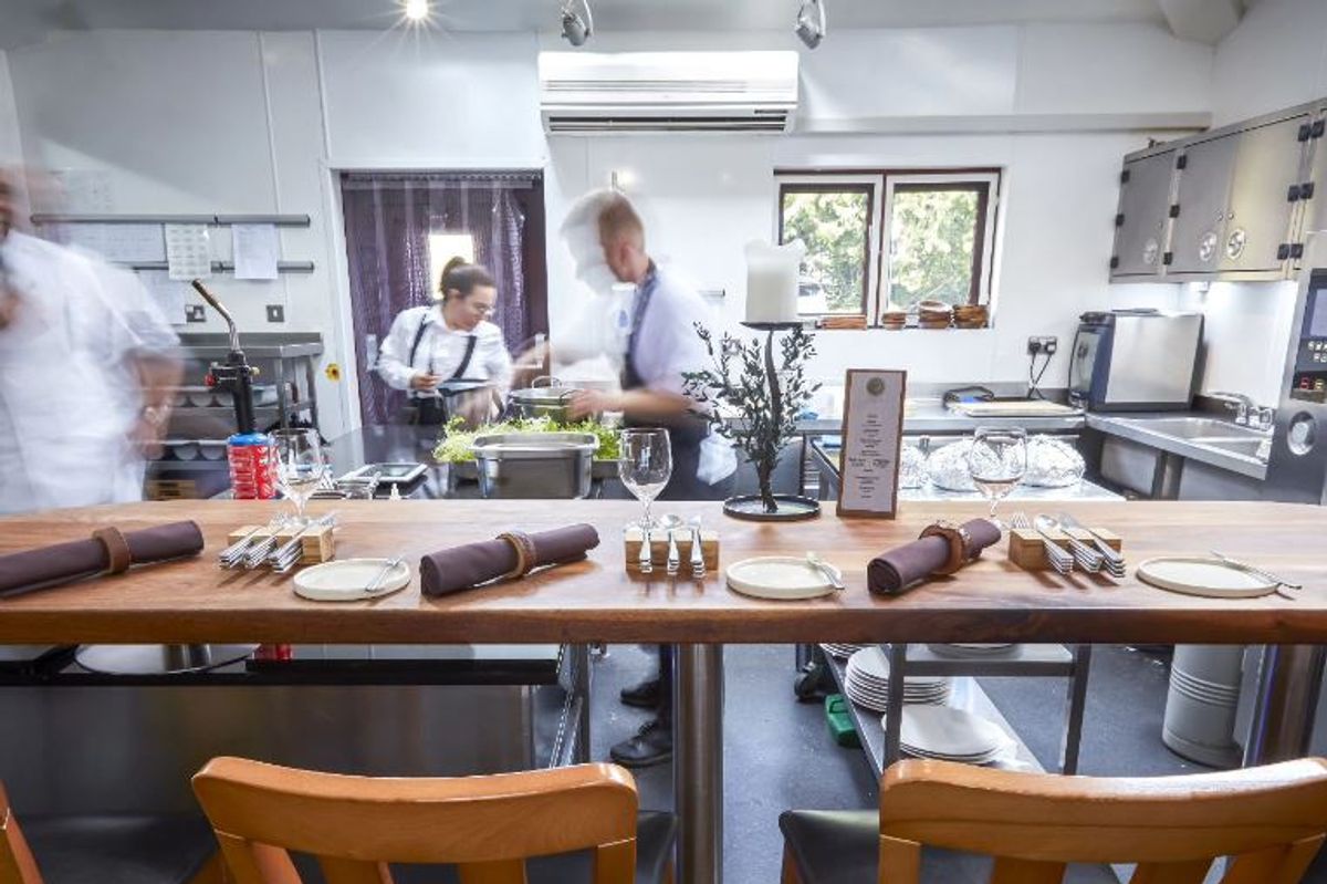 Tasting Room at Restaurant Sat Bains: gourmet kitchen for culinary events and exclusive dinners. - Banner