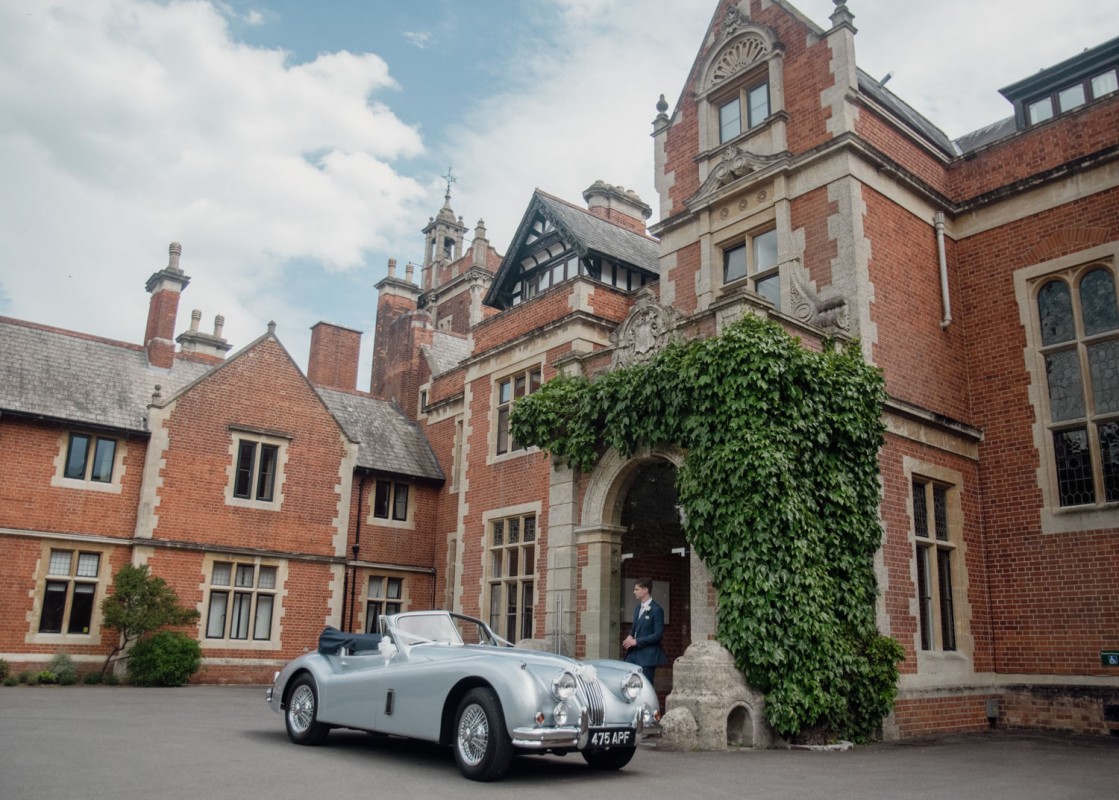 Ivy-clad Frensham Hall manor house exterior for luxury weddings and corporate retreats.