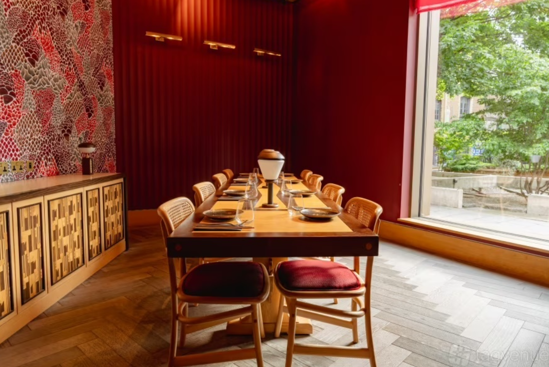 Private dining room in UBA Restaurant with red decor for board meetings and exclusive events.
