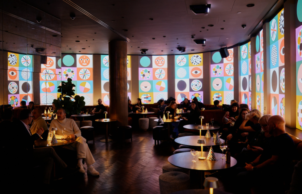 Byrd Lounge event space with projection mapping for intimate networking and evening receptions.
