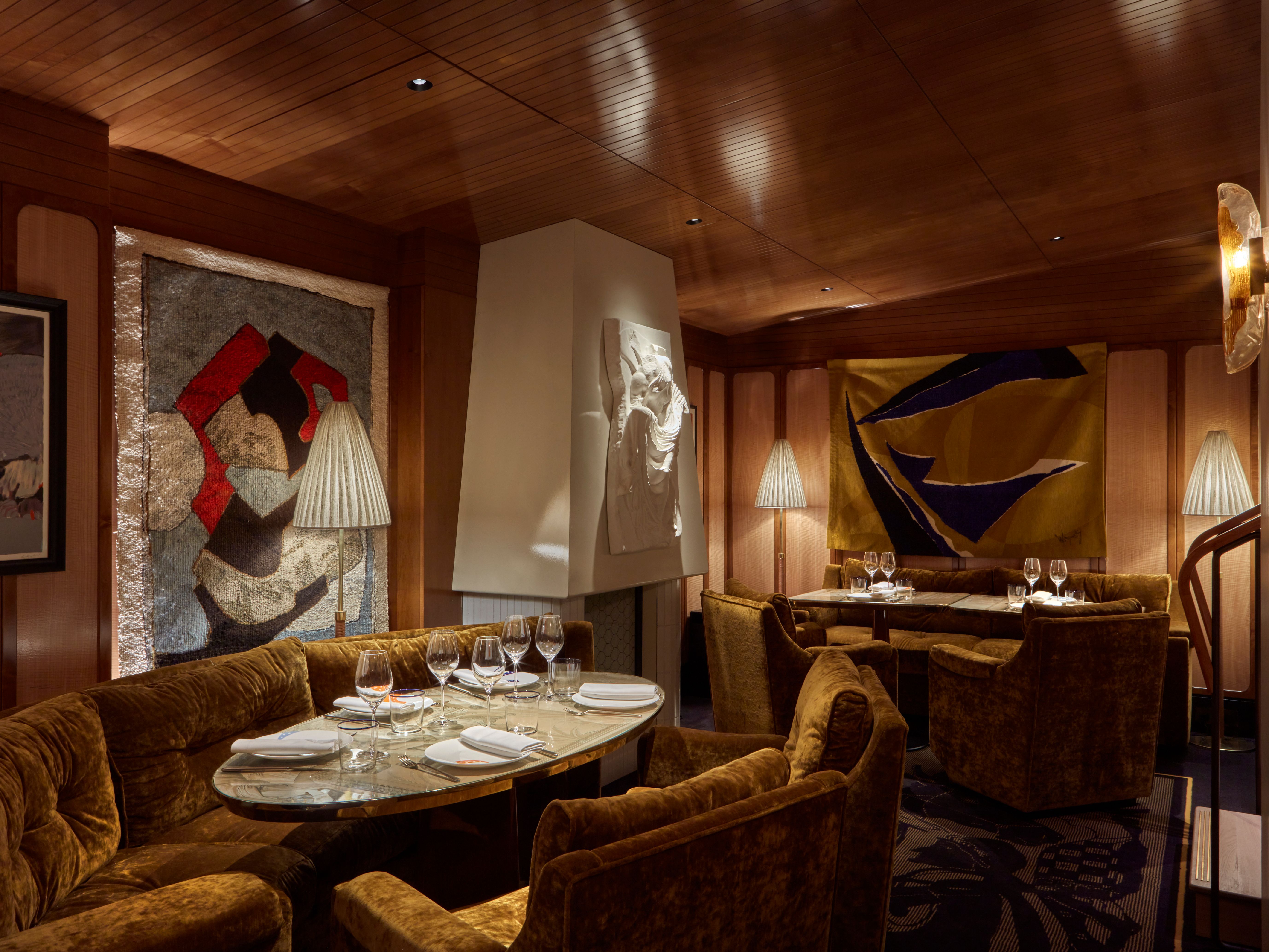 Executive dinner setting at Il Gattopardo, plush seating for private board meeting events. - Banner