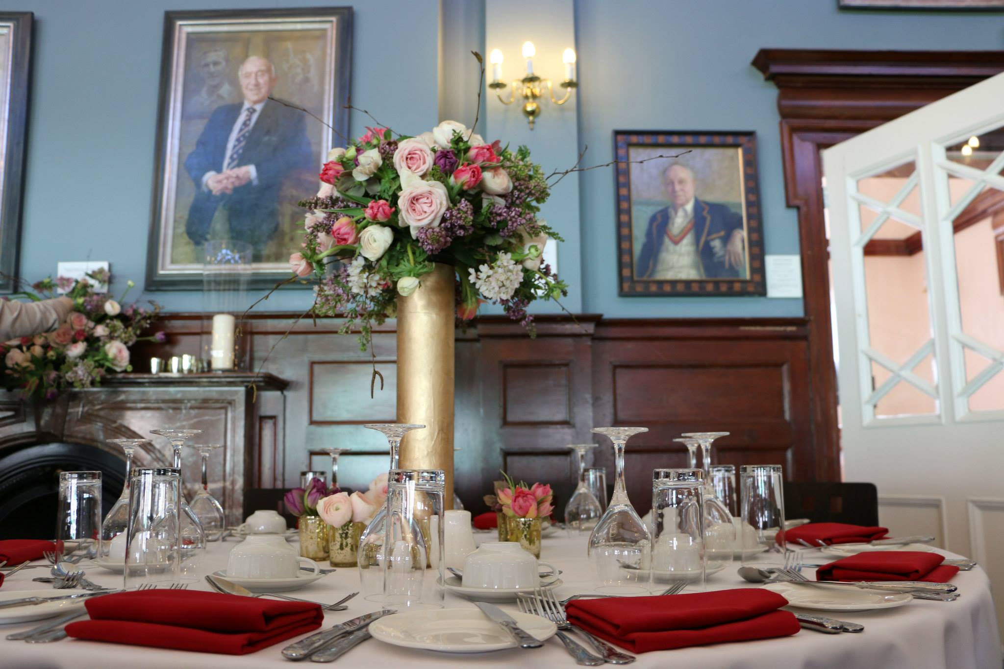 Long Room at Kia Oval with elegant floral centerpieces for formal gala or celebratory luncheon.