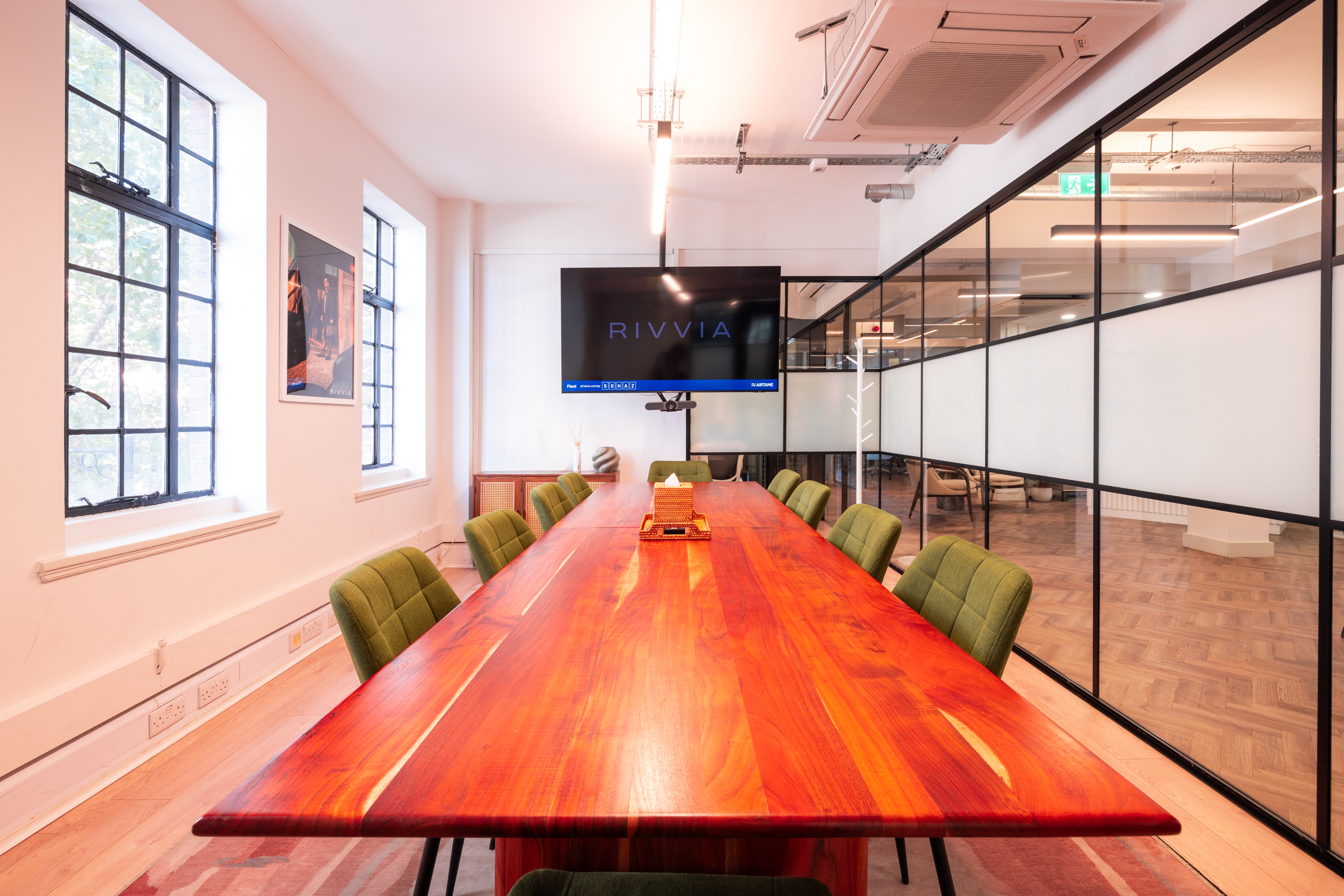 Modern Fleet boardroom with wood table for professional meetings and strategy sessions.