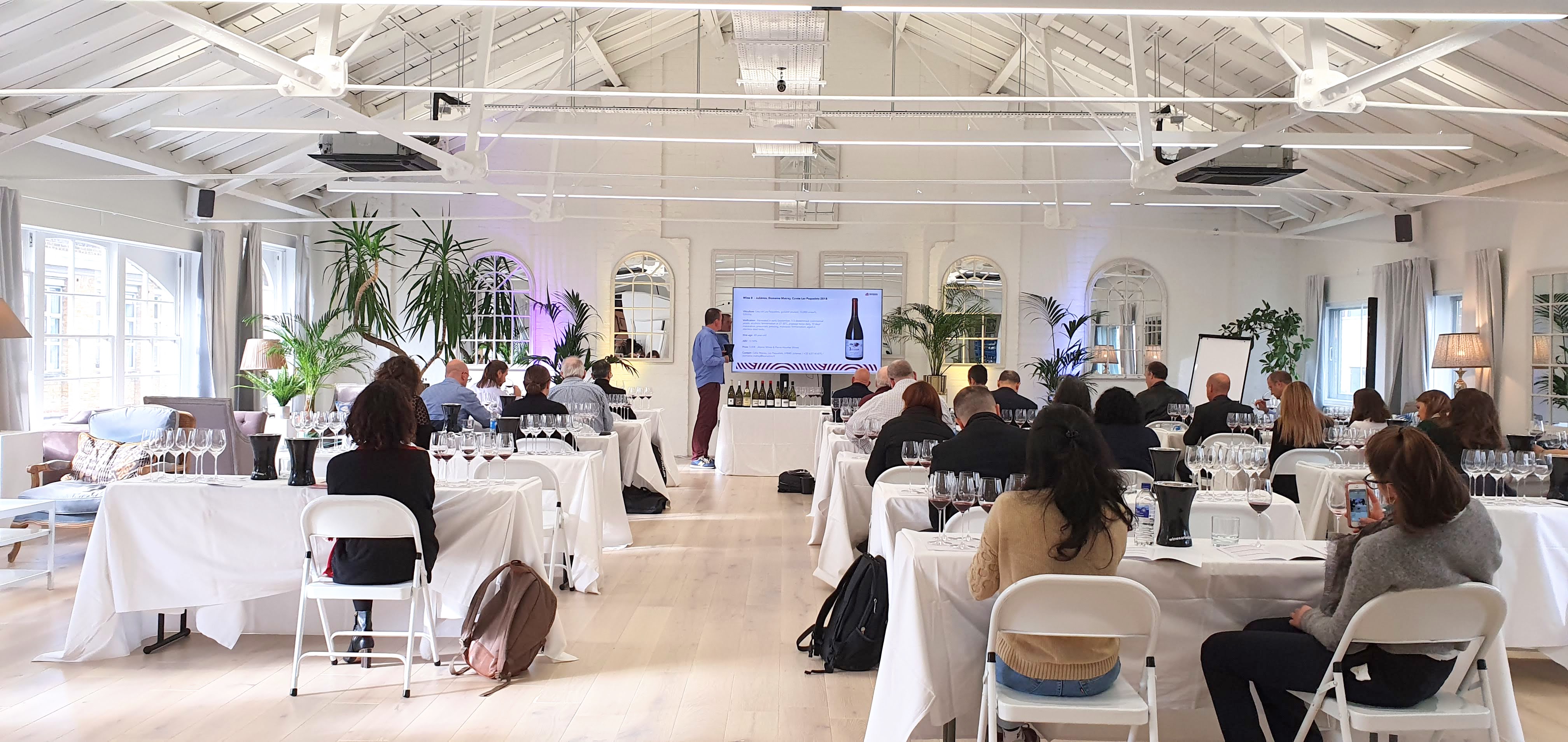 Corporate beverage workshop at Underwood Lofts with industrial-chic classroom setup.